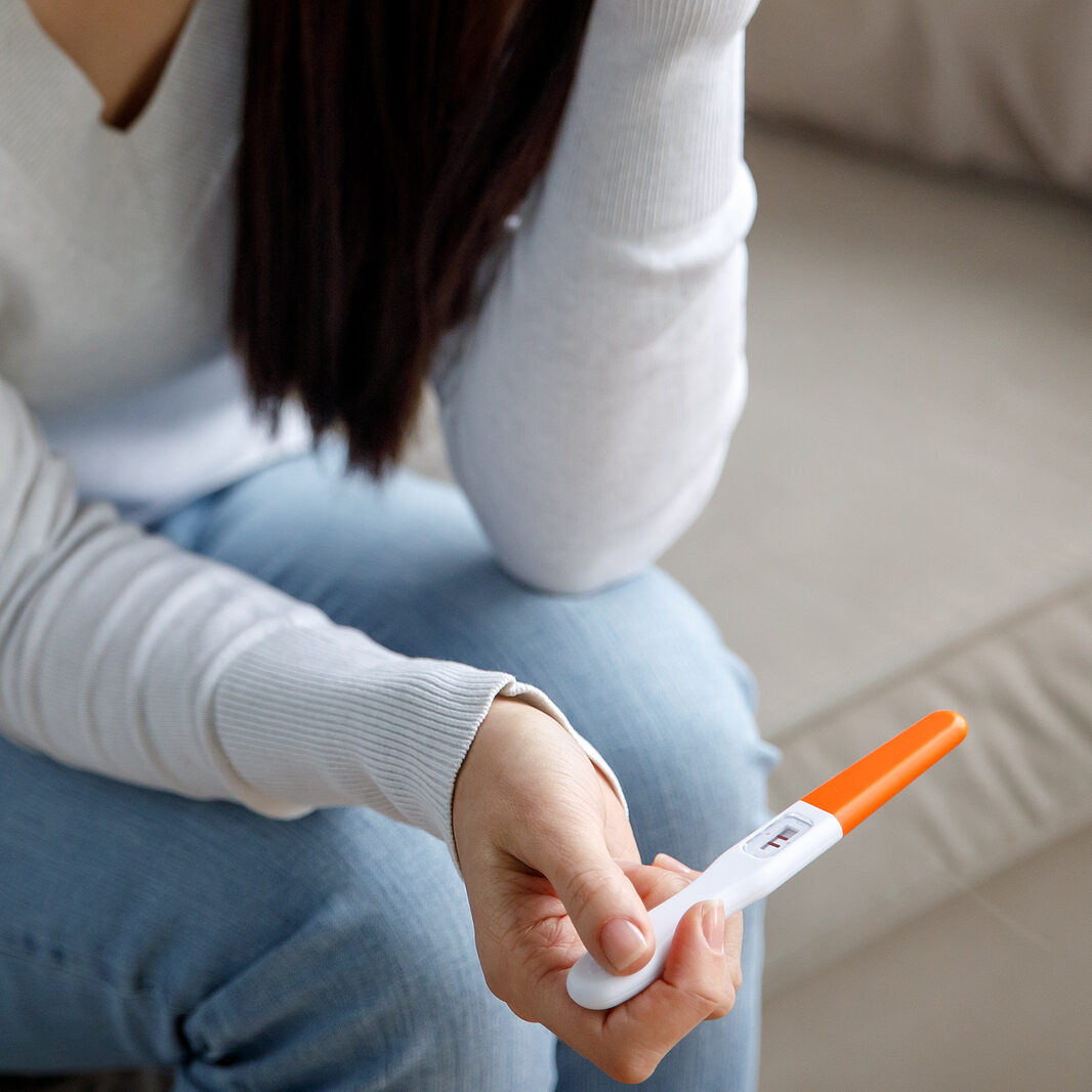 A Sad Woman Holds A Pregnancy Test In Her Hand. Unwanted Pregnan A woman in Texas wondering "How Late Can You Take the Abortion Pill?"