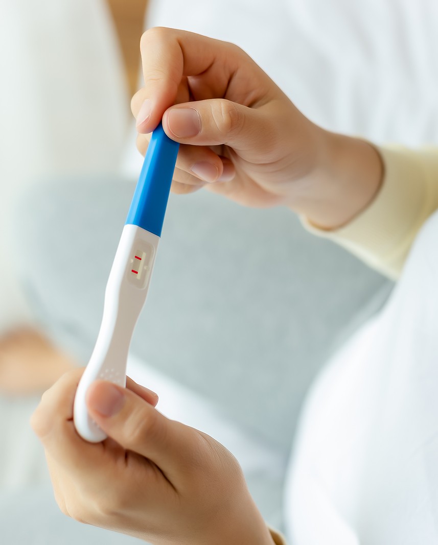 bigstock-Happy-Pregnant-Woman-Holding-P-379522099 A woman taking a free and confidential pregnancy test at Choices Resource Center