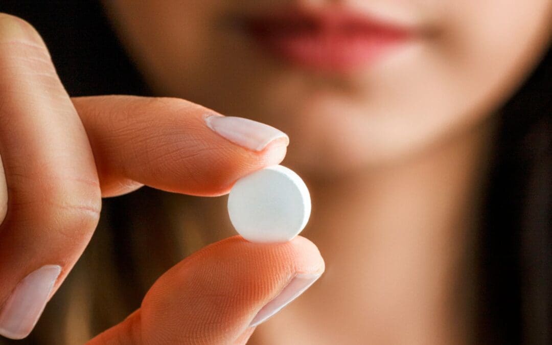 woman taking the abortion pill