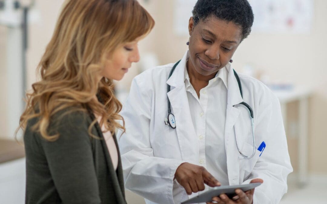 doctor and woman speaking at clinic